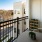 a balcony with a table and chairs