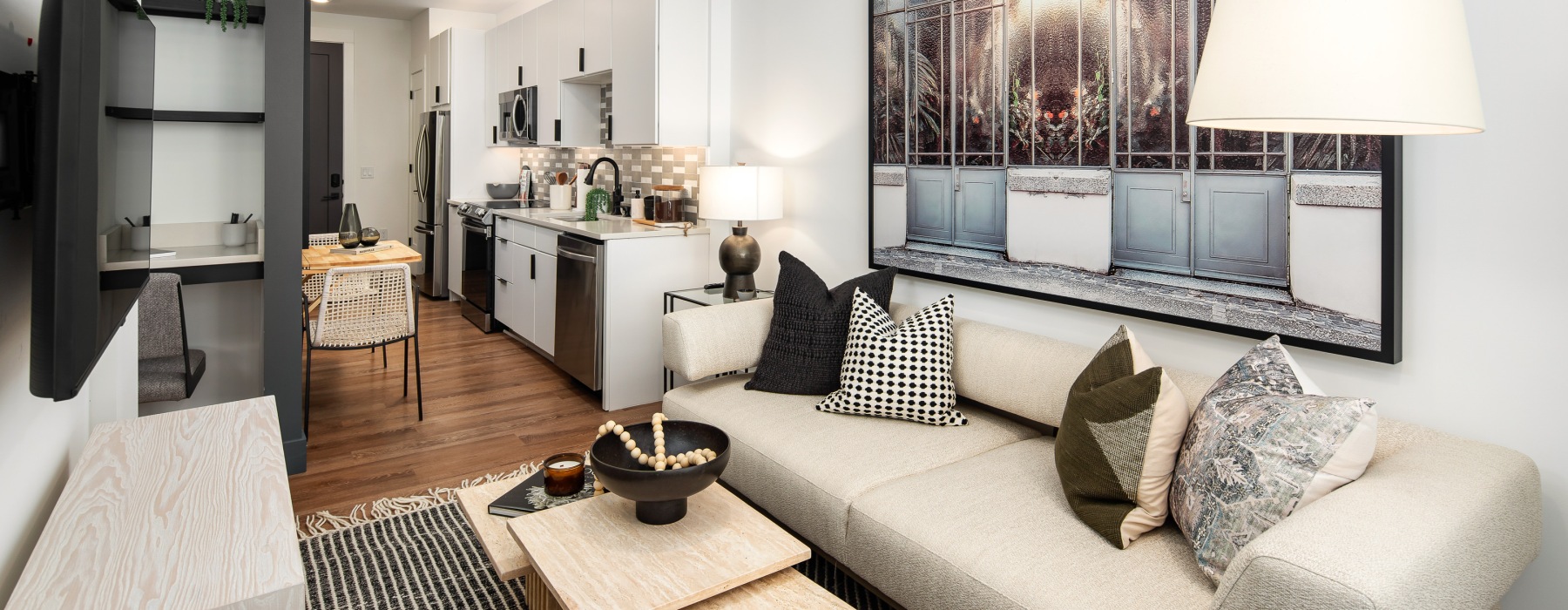 Apartment living room with modern furnishings at NOVEL Edgehill in Nashville, TN.