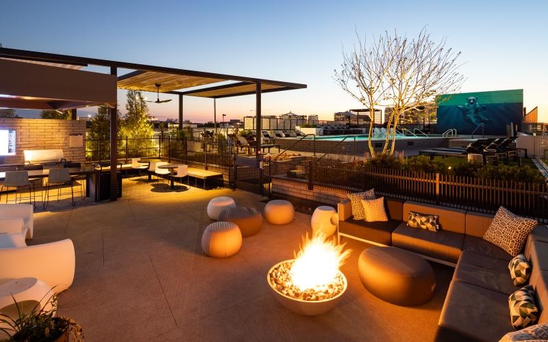 a patio with a fire pit