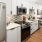 a kitchen with white cabinets