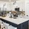 a kitchen with white cabinets