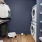 closet space with hanging clothes and stackable washer/dryer