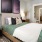 a bedroom with a bed and a table