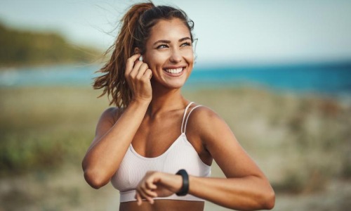 Get your workout on woman out for exercise at the beach