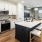a kitchen with white cabinets
