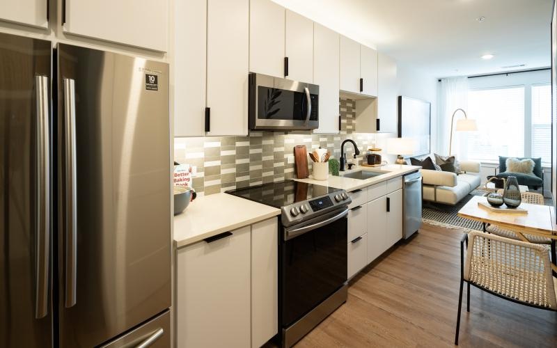 a kitchen with white cabinets
